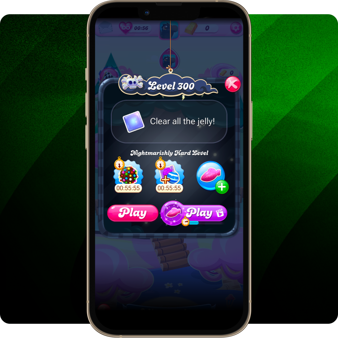 A smartphone screen showing a level selection screen in a candy-themed game, with a prompt offering a free booster for watching a video.